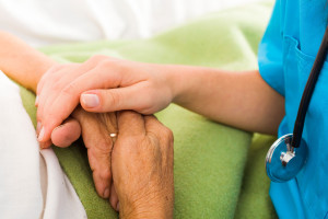 Nurses helping elderly